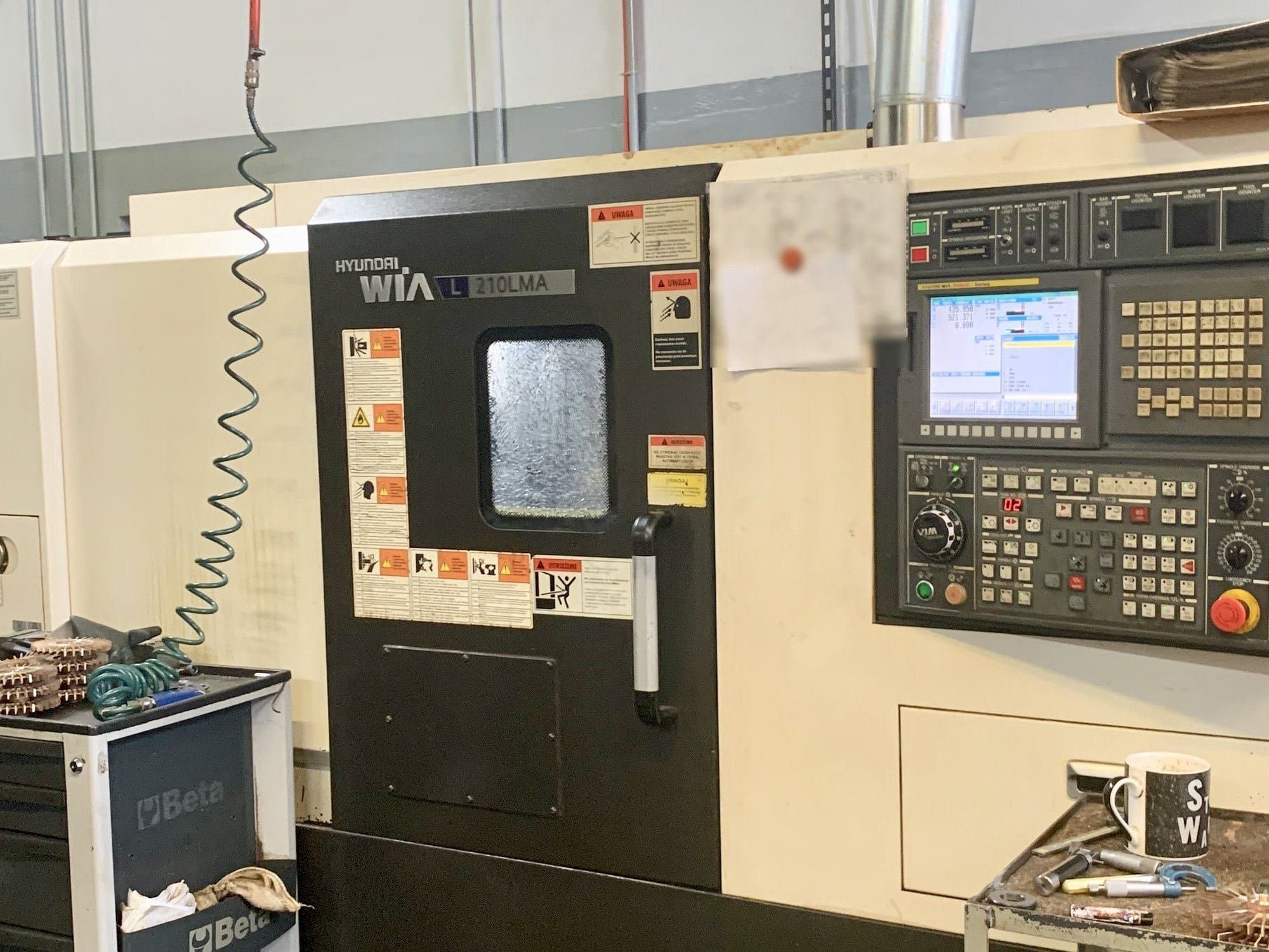 Вид станка Hyundai Wia L210LMA  спереди