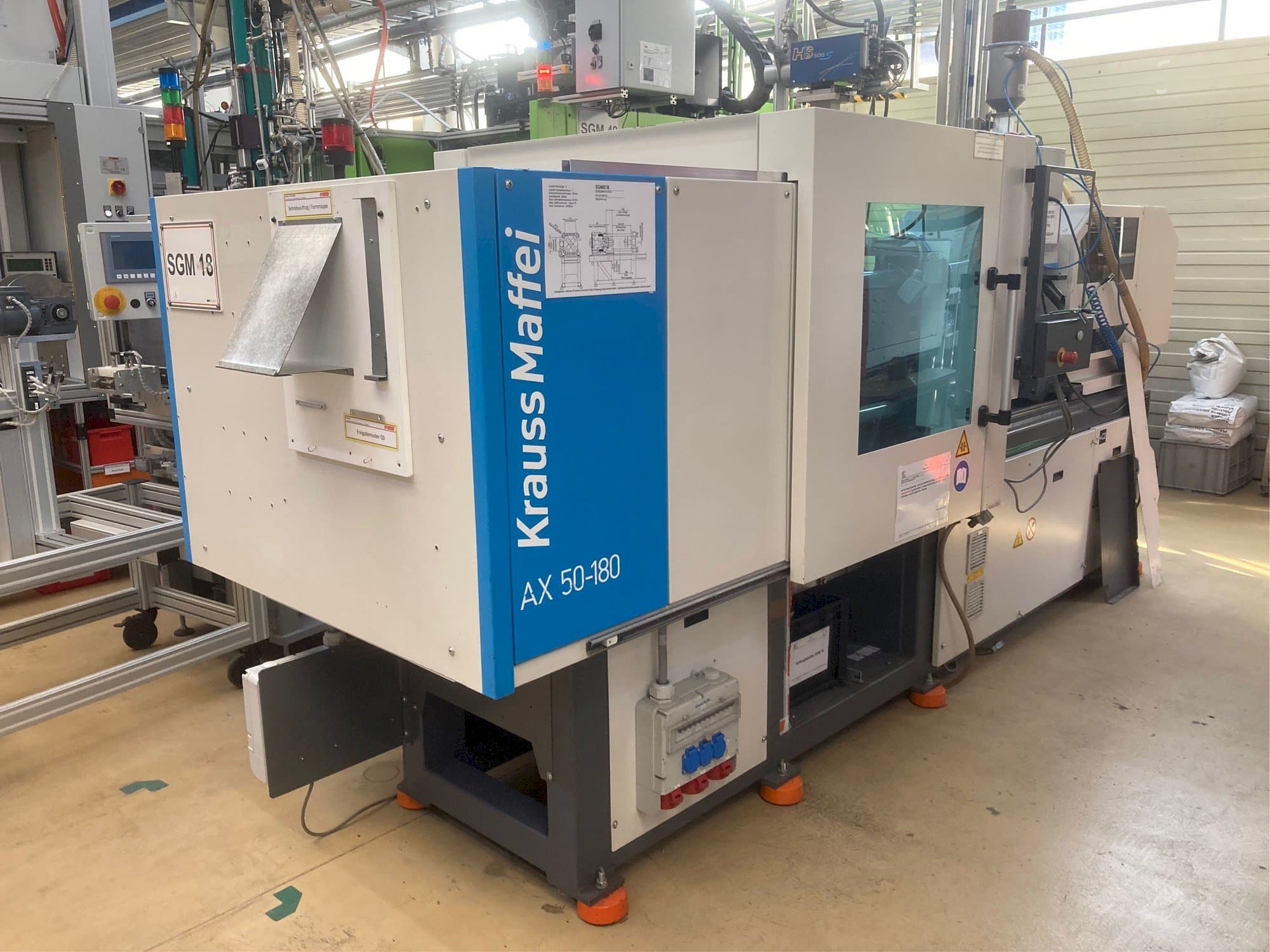 Вид  станка с Krauss Maffei AX 50-180  правой стороны