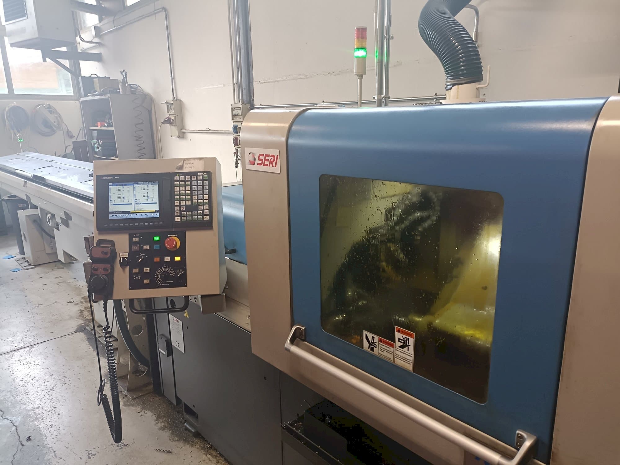 Вид станка NOMURA   спереди