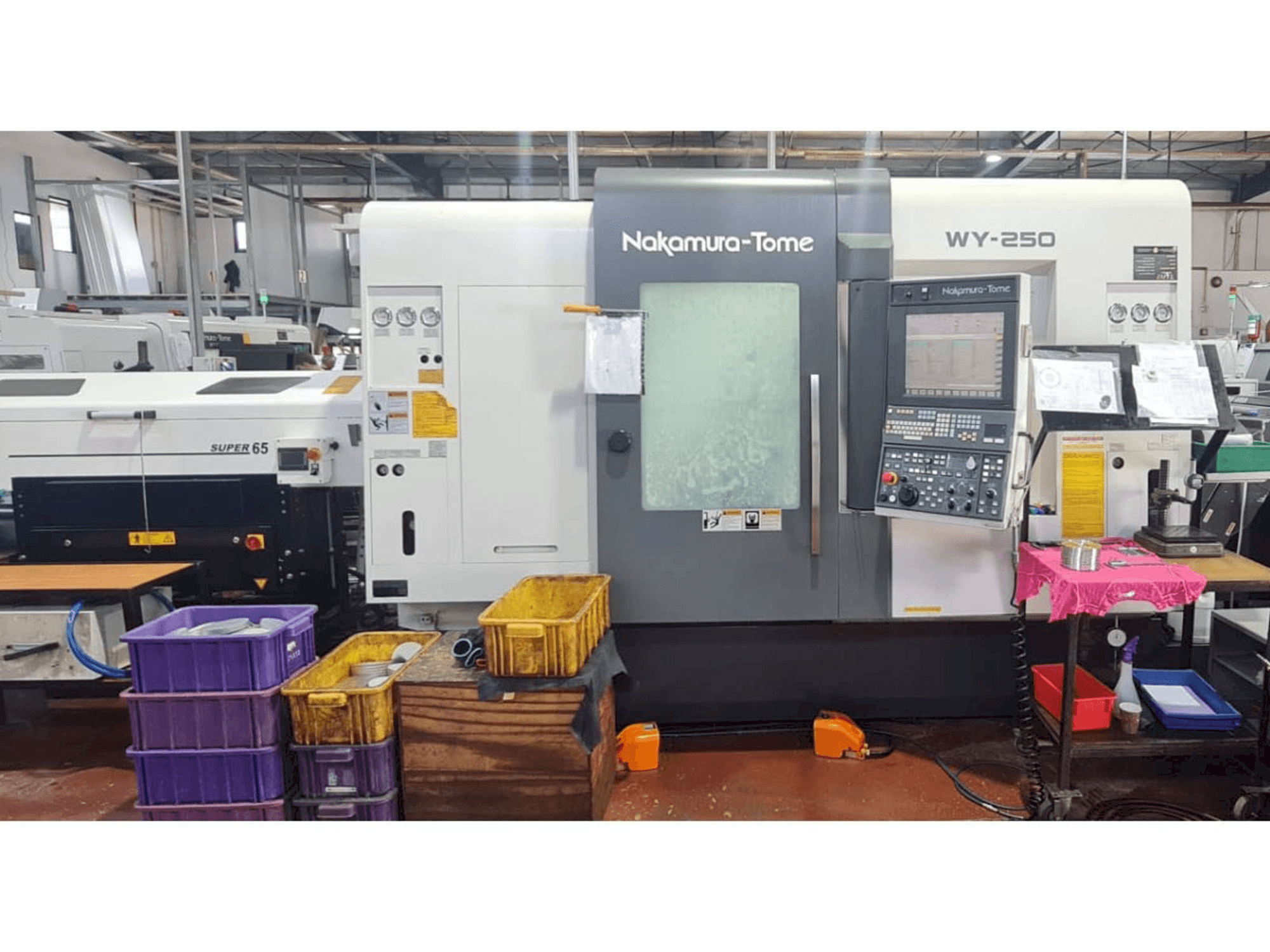 Вид станка NAKAMURA-TOME WY 250 спереди